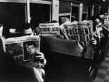 Commuters Reading of John F Kennedy's Assassination