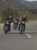 Hell's Angels Riding Motorcycles on Road