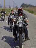 Hell's Angels Riding Motorcycles on Road