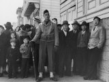 Soldier Standing Guard of Japanese American Citizens Awaiting Transport to Relocation Camps
