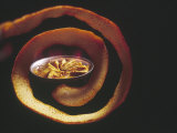 Crepes Suzette Simmering in Pan of Cointreau Surrounded by Swirl of Orange Peel
