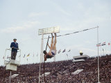 Athlete Clearing the Pole Vault at Summer Olympics