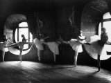 Ballerinas at Barre Against Round Windows During Rehearsal For "Swan Lake" at Grand Opera de Paris