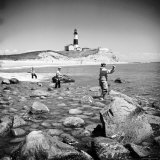 Surf Casting Fishermen Working the Shore Near the Historic Montauk Point Lighthouse