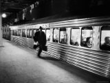Commuter on the New York New Haven Line Running to Catch Train Pulling Out of Grand Central Station
