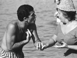 Italian Man Talking to a Woman While Enjoying a Day at the Beach