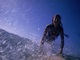 Low Angle View of a Teenage Girl Riding a Surfboard