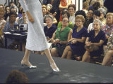Employees of Saks Fifth Avenue Watching a Fashion Show Promoting Mid Length Skirts