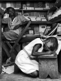 Kneeling Schoolgirl Writing on Wooden Bench Accura  Gold Coast  Ghana