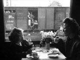Wife and Daughter of US Soldier in First Class Dining Car Looking at German "Expelles" in Boxcars