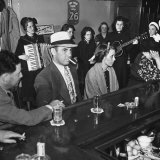 The Salvation Army Band Playing Musical Instruments and Singing in a Bar