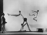 Erik Flensted Jensen  Coach of Danish Gymnastic Team  Watching as Three Men Perform