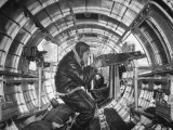 Crewman Poking His 50 Cal Machine Gun Out of Side Window of B-17E Flying Fortress During WWII