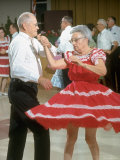 Elderly Couple Dancing  Woman's Red Skirt Swirling  in Retirement Community