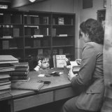 Special Child Checking Out a Book from the Librarian
