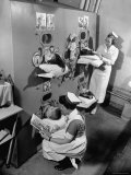 Nurses at Children's Hospital Tending Young Polio Patients Contained in Iron Lung Room