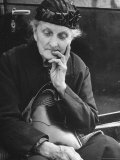 French Refugee Woman Sitting on the Step of Her Car