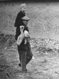 French Refugee Carrying His Little Boy  Who Clutches His Teddy Bear