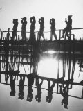 Bird Counters of the Audubon Society Standing on a Bridge