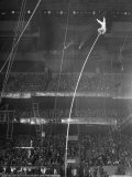 Circus Performer Alberty at Top End of 45 Ft Pole Doing a Handstand with His Feet in the Air