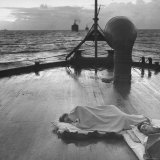US Sailors Sleeping on Deck of Ship