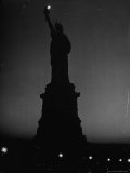 Silhouette of Statue of Liberty Lit by Two 200 Watt Lamps During Wartime Effort to Conserve Energy
