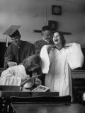 Hempstead High School Seniors Happily Helping Each Other with Graduation Gowns Before Commencement