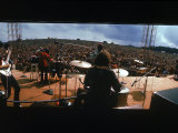 Huge Crowd Listening to a Band Onstage at the Woodstock Music and Art Festival