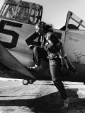 Female Pilot of the Us Women's Air Force Service Posed with Her Leg Up on the Wing of an Airplane
