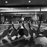 Man Holding His Releasing Stance as He Watches Himself Get a Strike