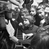 Children Singing Around the Piano at Orphanage
