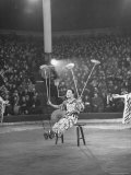 Juggler Spinning Seven Plates at Once