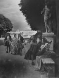 Costumed People Wandering Around the Gardens of Versailles
