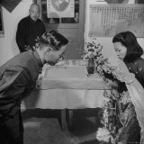 Bride and Groom Exchanging Rings During Wedding at Hwa Ching Hot Springs