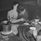 GI Kissing His Lady Friend After a Glass of Champagne