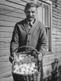 Man Holding Basket Full of Eggs