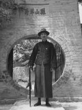Chairman of People's Assembly Standing Before Gate of Compound