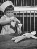 Carae Schrader Playing with a Doll at the Children's Hospital
