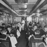 GI Personnel and Their Wives Eating in Dining Car While Civilians Will Have to Wait Until Later