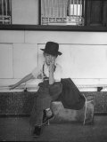 Little Boy Sitting on His Luggage While Waiting For the Train at the Denver Union Station