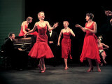 Four Models in Red Dresses Dancing Charleston For Article Featuring "The Little Red Dress"