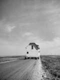 House on Wheels Being Pulled Along Road in the Town of Underwood