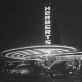 Cars Sitting Outside of a Drive in Restaurant