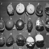 Jet Pilot Helmets and Goggles Hanging on Hooks