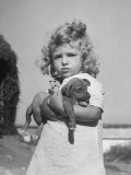 Little Girl Holding Puppy