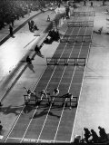 Four Runners Clearing Hurdles in 60 Yard Dash at Mellrose Games