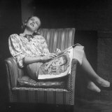 Woman Relaxing in a Chair Daydreaming