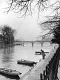Man Near Rowboats on the Banks of Seine River
