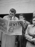 Couple Reading Newspaper Account of the Death of Evita Peron at 33 from Cancer