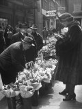 Man Selling Spring Flowers on the Sidewalk